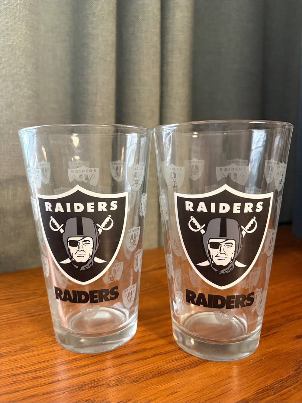 Riders  Clear Glass Pint Set with Black Raiders Shield (Pair)